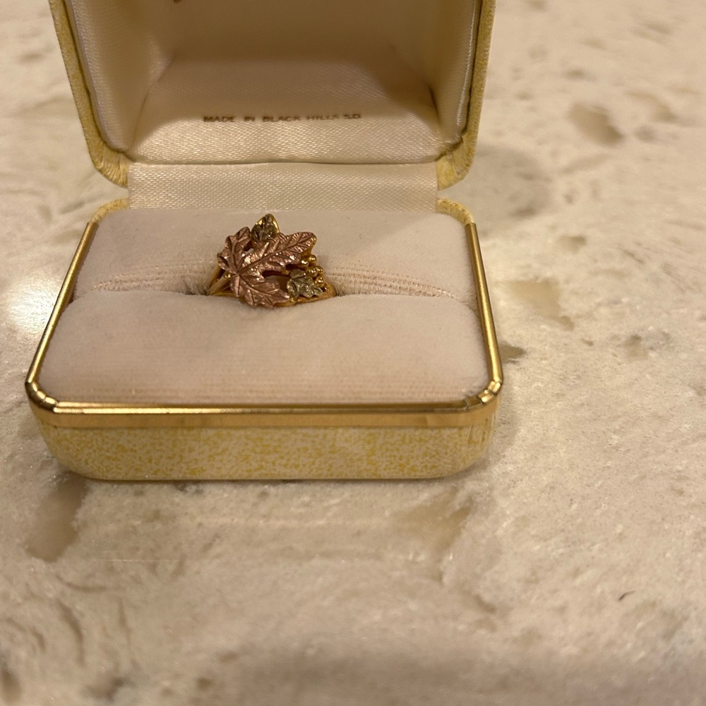 Landstrom’s Black Hills Elegant Gold and rose Ring with Intricate Design.